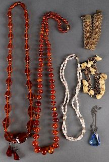 A COLLECTION OF AMBER, PEARL, AND IVORY JEWELRY