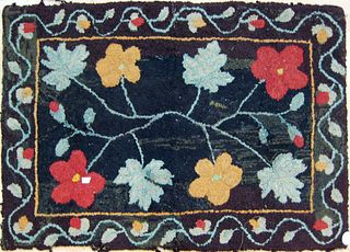 Hooked rug with floral decoration, early 20th c.,'