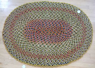 Three braided rugs.