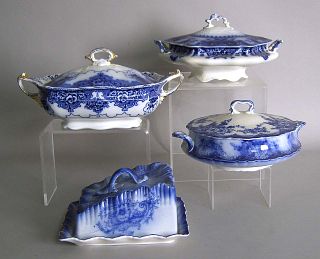 Three flow blue covered tureens, together with a b