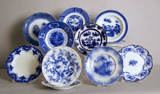 Eleven flow blue plates and soup bowls.