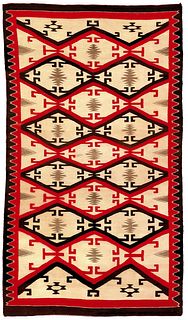 Navajo regional rug in red, brown, and ivory withe
