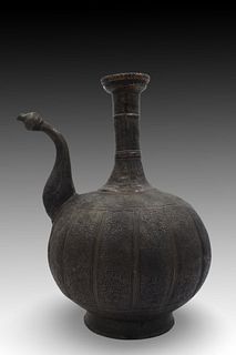 An Islamic Water Jug with an Exquisite Patterned Design.

Height: Approximately 30 cm. 