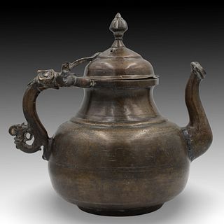 An Islamic Mughal Bronze Teapot from the 19th Century with Intricate Carvings.

Height: Approximately 26cm 