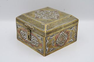 An Islamic Egyptian Brass Box with Silver Inlay and Wooden Inside

Height: Approximately 8.2cm
Length: Approximately 13cm 