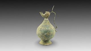 An Islamic Bronze Jug with Silver Inlay from the 12th Century

Height: Approximately 31cm 