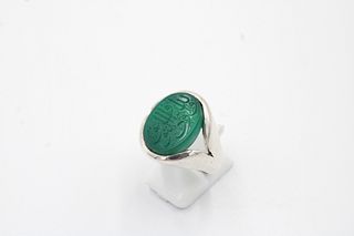 An Islamic Silver Ring with Green Agate and Islamic Calligraphy

Ring Size: V 
