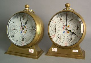 Pair of World Time brass shelf clocks in the formf