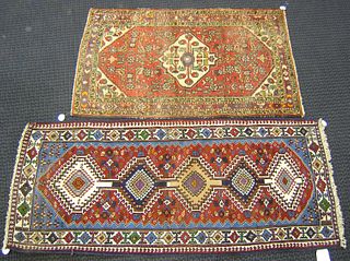 Two oriental throw rugs, 5' x 3'1" and 6'7" x 2'10
