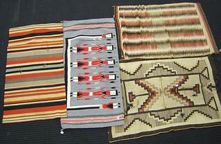 Yei rug, together with 3 other rugs.