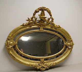 19 Century Oval Giltwood Mirror With Dove Crown.