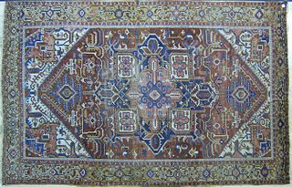 Roomsize Heriz rug, ca. 1920, with a blue medallio