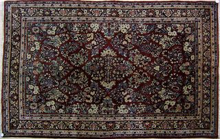 Sarouk throw rug, ca. 1920, with overall floral pa