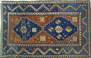 Kazak throw rug, ca. 1900, with 2 blue medallionsn