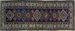 Caucasian long rug, ca. 1915, with 7 medallions on