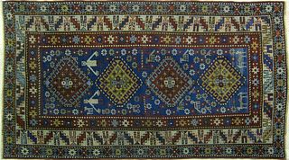 Shirvan throw rug, ca. 1900, with 4 medallions on