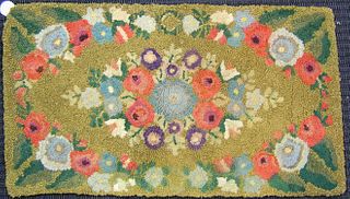 Four hooked rugs, early 20th c., with floral decor