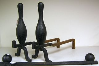 Pair of cast iron bowling pin andirons, 20th c., 2