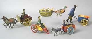 Five painted tin cart toys, early 20th c., to incl