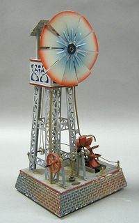 Painted tin doll windmill, early 20th c., 15" h.