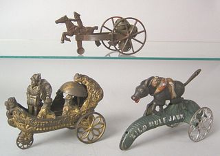 Three cast iron bell toys to include Columbus's la