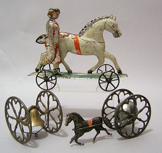 Three early American tin bell toys, one a horse tr