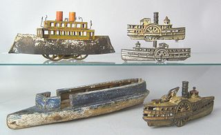 Five assorted cast iron wood and tin boats to incl