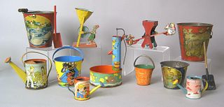 Eleven painted tin sand pails and watering cans, e