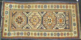 Kazak throw rug, ca. 1910, with 4 medallions on aa