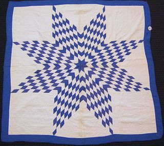 Pieced Lone Star quilt, late 19th c., in blue andh