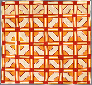 Pieced quilt, early 20th c., in a sun and grid pat