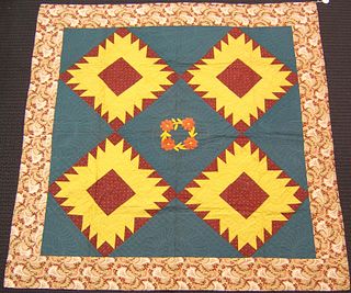 Pieced quilt, early 20th c., with central trapunto