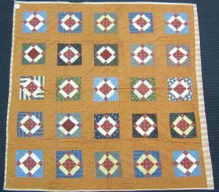 Pieced quilt, early 20th c., in a diamond and grid