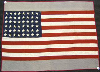 Pieced flag quilt, early 20th c., 70" x 33".