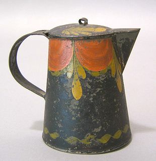 Black toleware syrup pitcher, 19th c., with red an