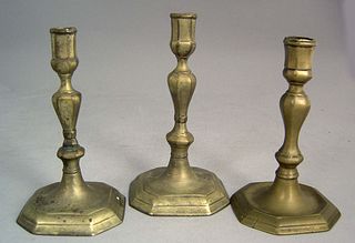 Three similar Queen Anne brass candlesticks, mid 1