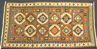 Moghan Kazak throw rug, late 19th c., with 12 meda