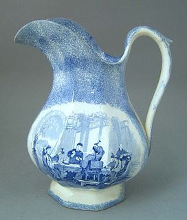 Blue spatter paneled pitcher with transfer interio