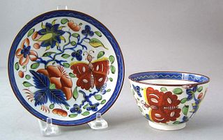 Gaudy Dutch cup and saucer in the butterfly patter