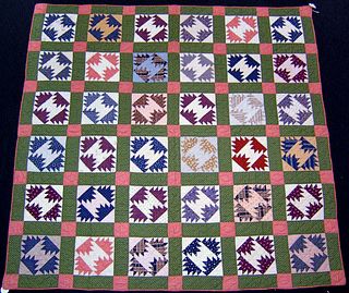 Pieced quilt, early 20th c., in a block pattern wi