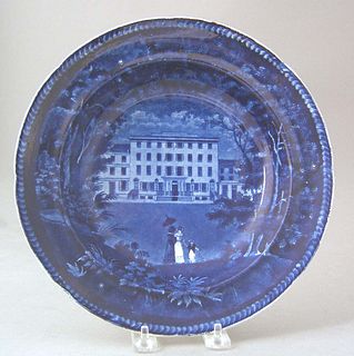Historical blue shallow bowl with view of the "U.S