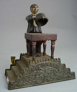 Magician mechanical bank by J & E Stevens Co., des