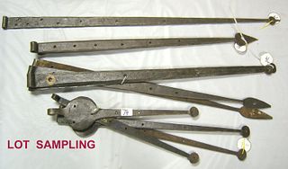 Nine pairs of wrought iron strap hinges, most with