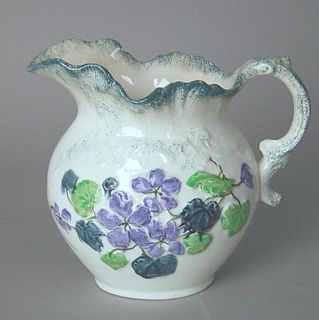 Wheeling Pottery Co. polychrome pitcher with relie