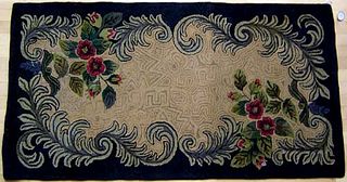 Three American hooked rugs with floral decoration,