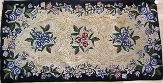 Two American hooked rugs with floral decoration, t