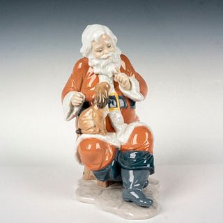 Santa's Little Secret 1006890 - Lladro Porcelain Figurine