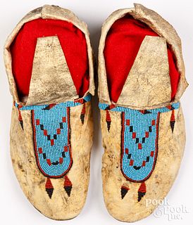 Pair of Blackfoot Indian beaded hide moccasins