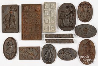 Eleven iron molds and a bag stamp