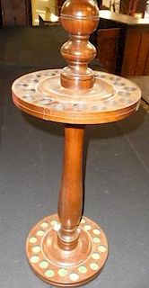 150. Cane Stand-  20th Century- A two tier hardwood cane stand which will hold 20 canes, the bottom holes have green velvet l